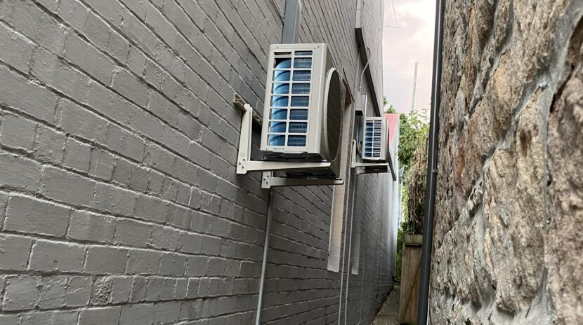 Condenser on the wall mounted brackets
