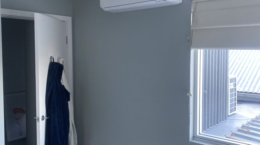 Mitsubishi split system installed in a bedroom in a house at Balmain.